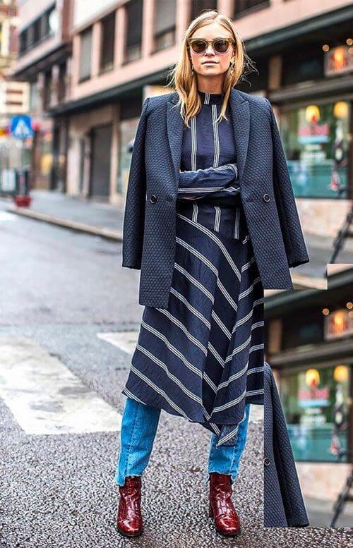 Look compuesto por varias capas, sobre un vestido a media pierna.